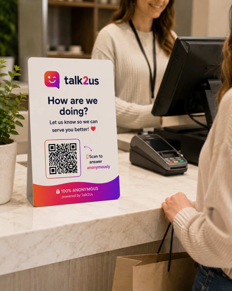 Talk2Us sign on a clothing shop's checkout counter